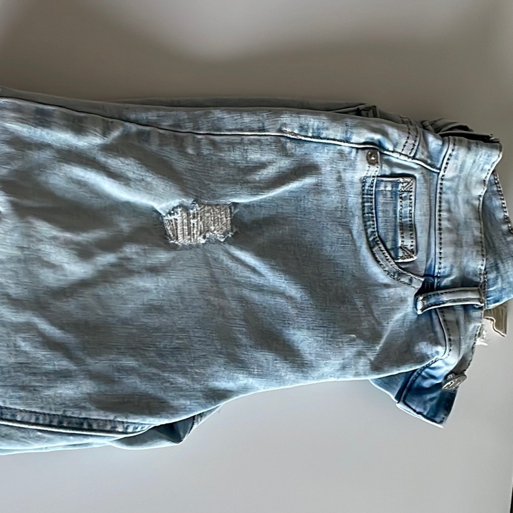 These jeans have wholes but they do not show skin